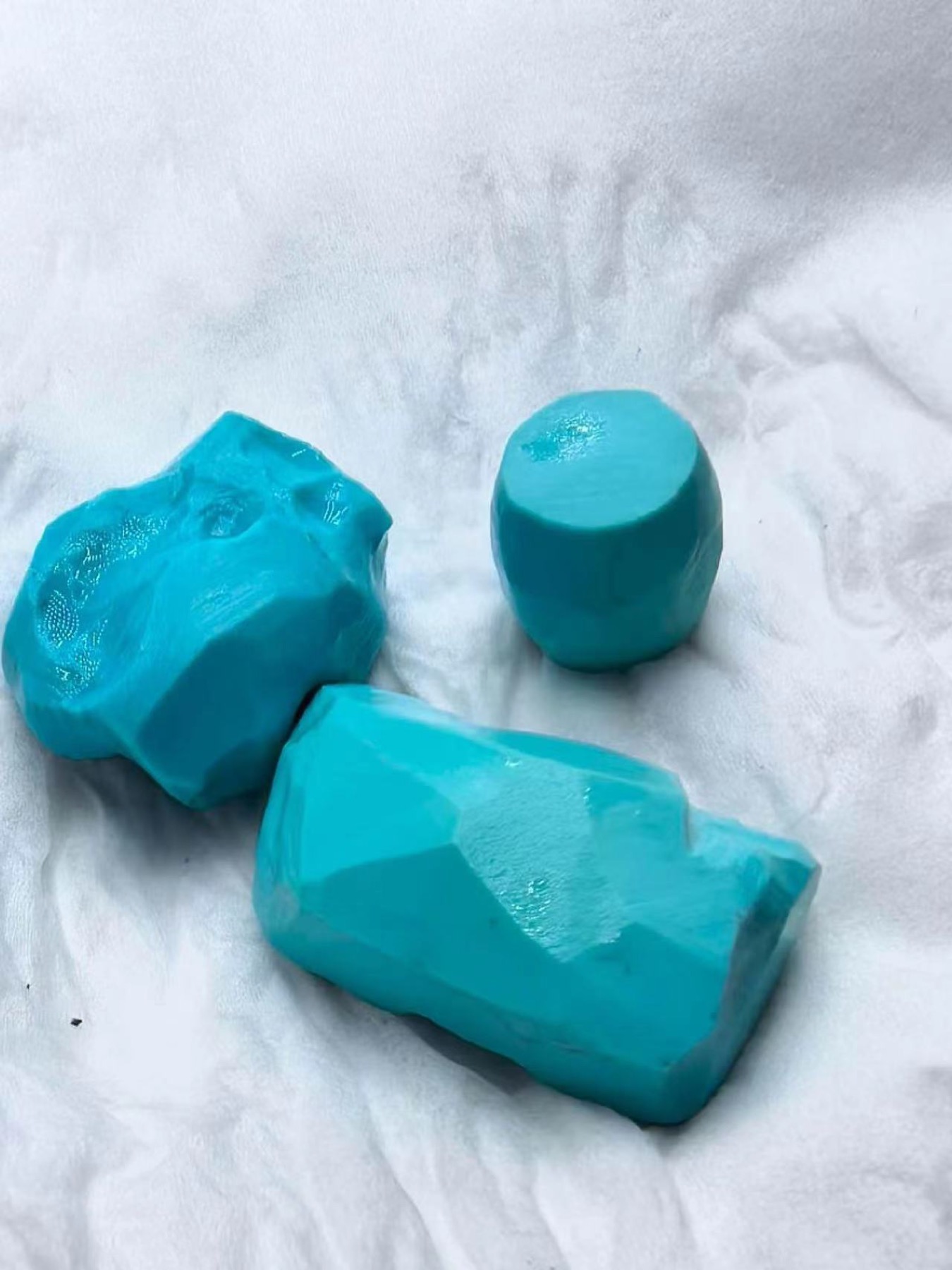 Three pieces of turquoise rough with much of the exterior host rock removed